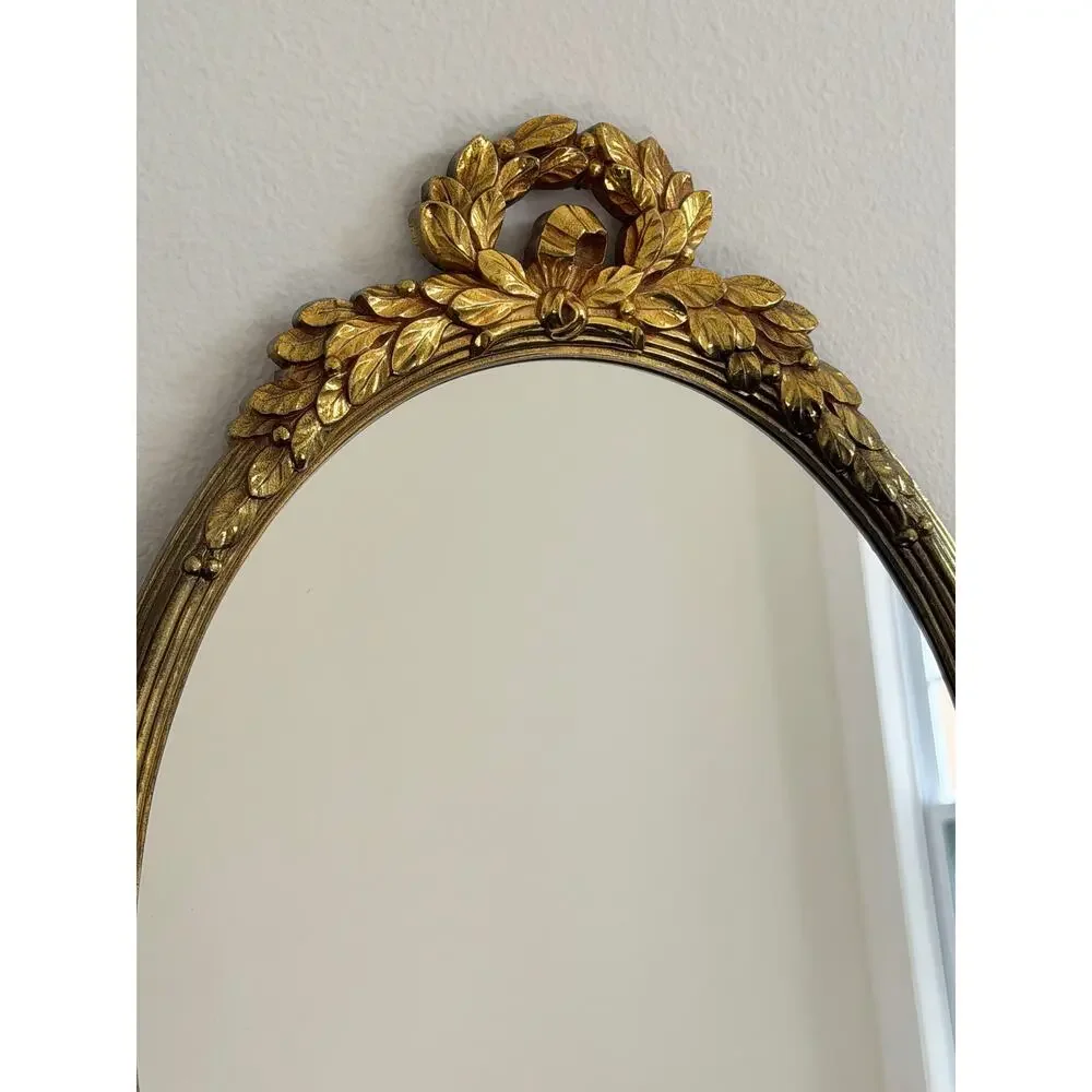 Vintage Hollywood Regency style mirror gold classic leaf wreath and ribbon crest